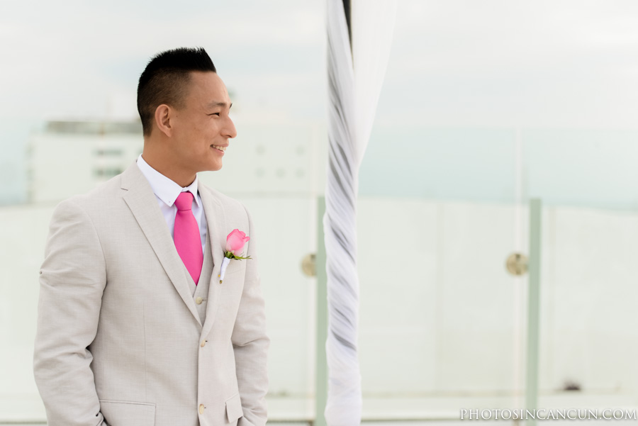Beach Palace Wedding Ceremony Groom waiting on the Sky Deck